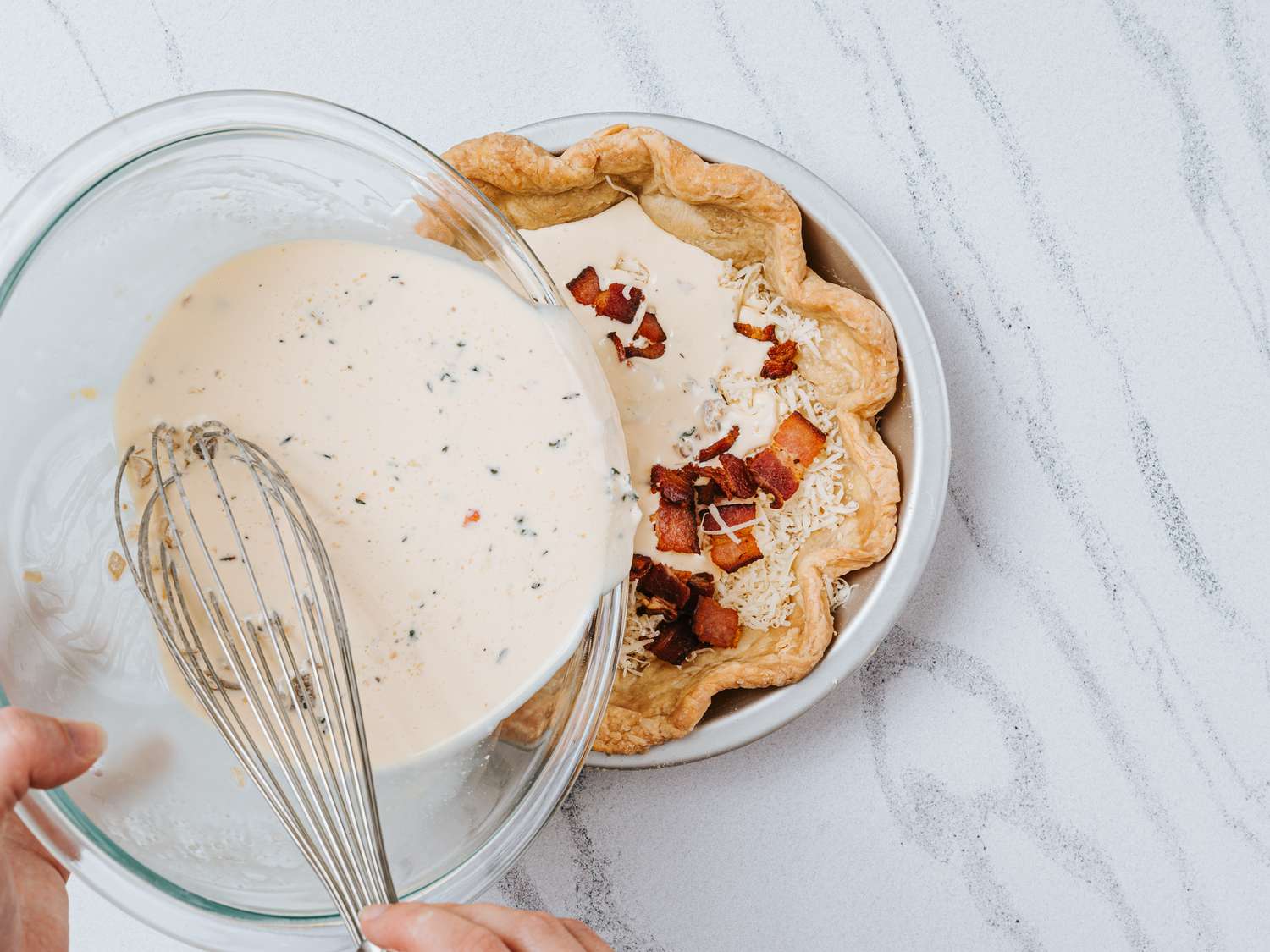 Pouring egg mixture into pie crust 