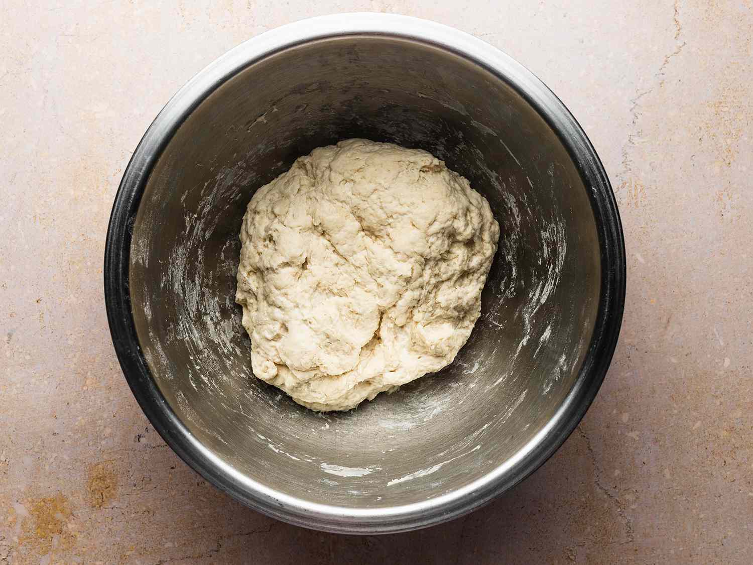 No-knead focaccia dough in a large bowl.