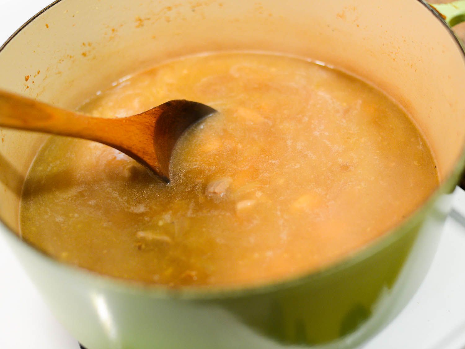 Stock is added to the Dutch oven.