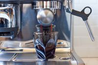 Espresso being brewed into a Not Neutral espresso cup.