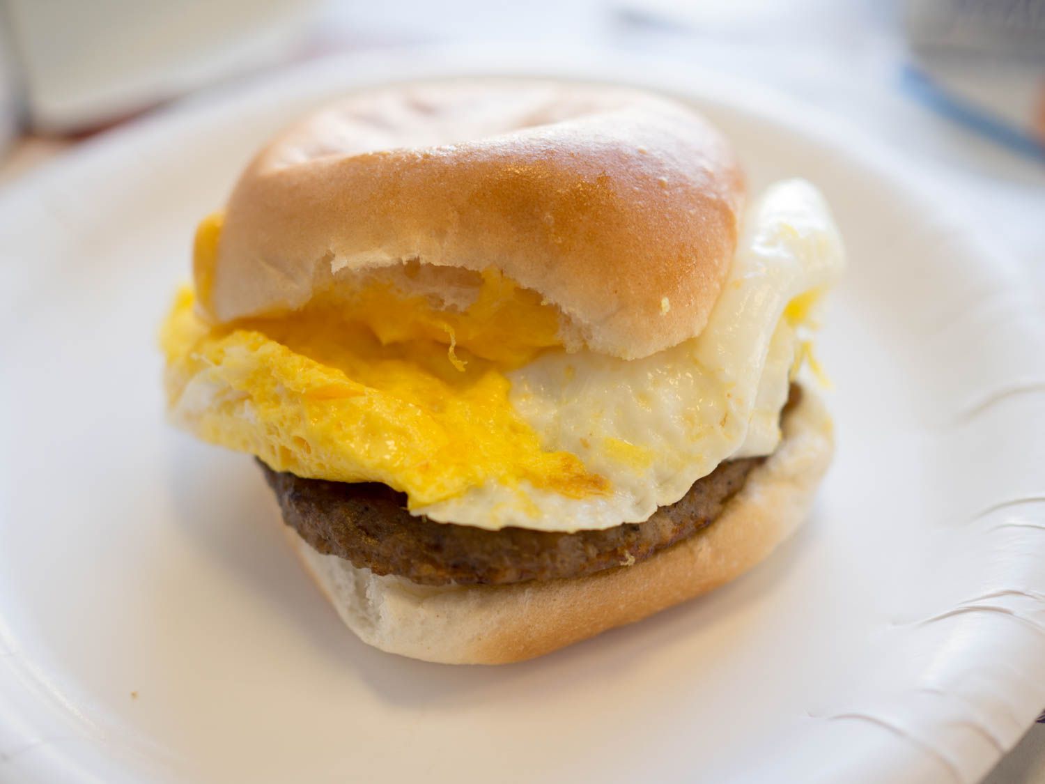 An egg sandwich from White Castle on a paper plate