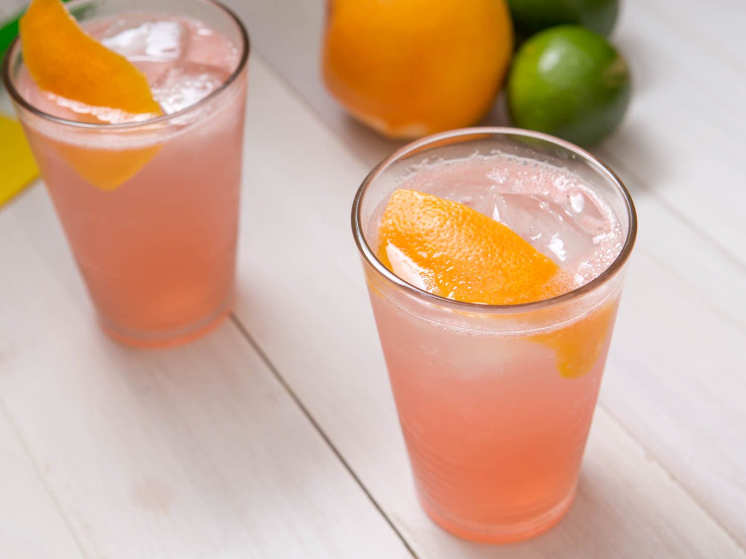 Two salted grapefruit cordial cocktail garnished with grapefruit peel