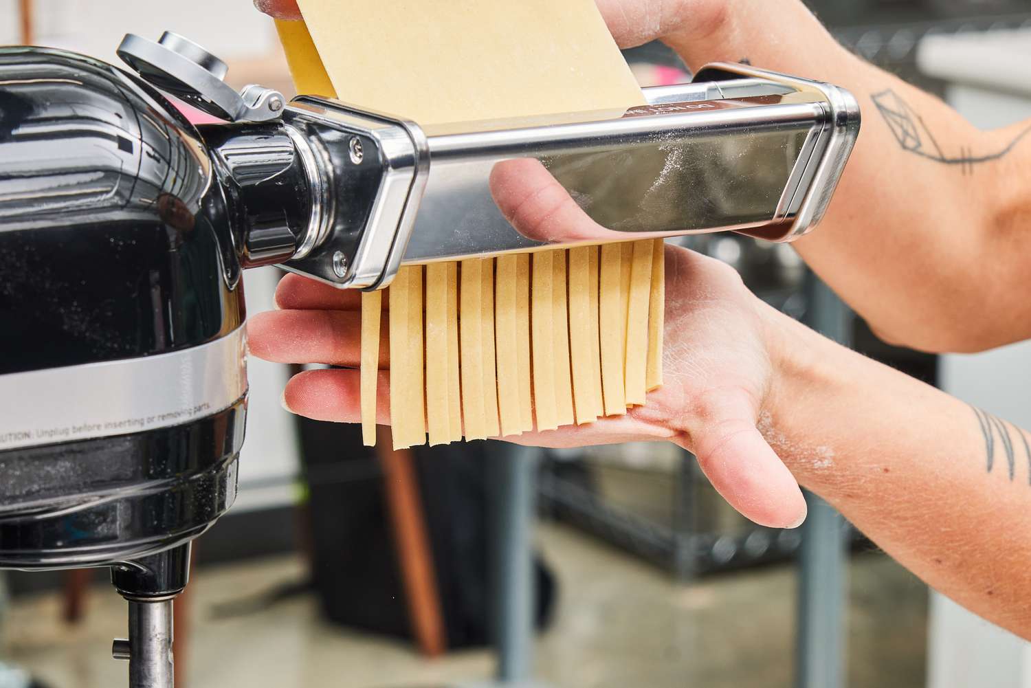 A person makes pasta using the GVODE 3-Piece Pasta Attachment Set for KitchenAid Stand Mixer (G1703)