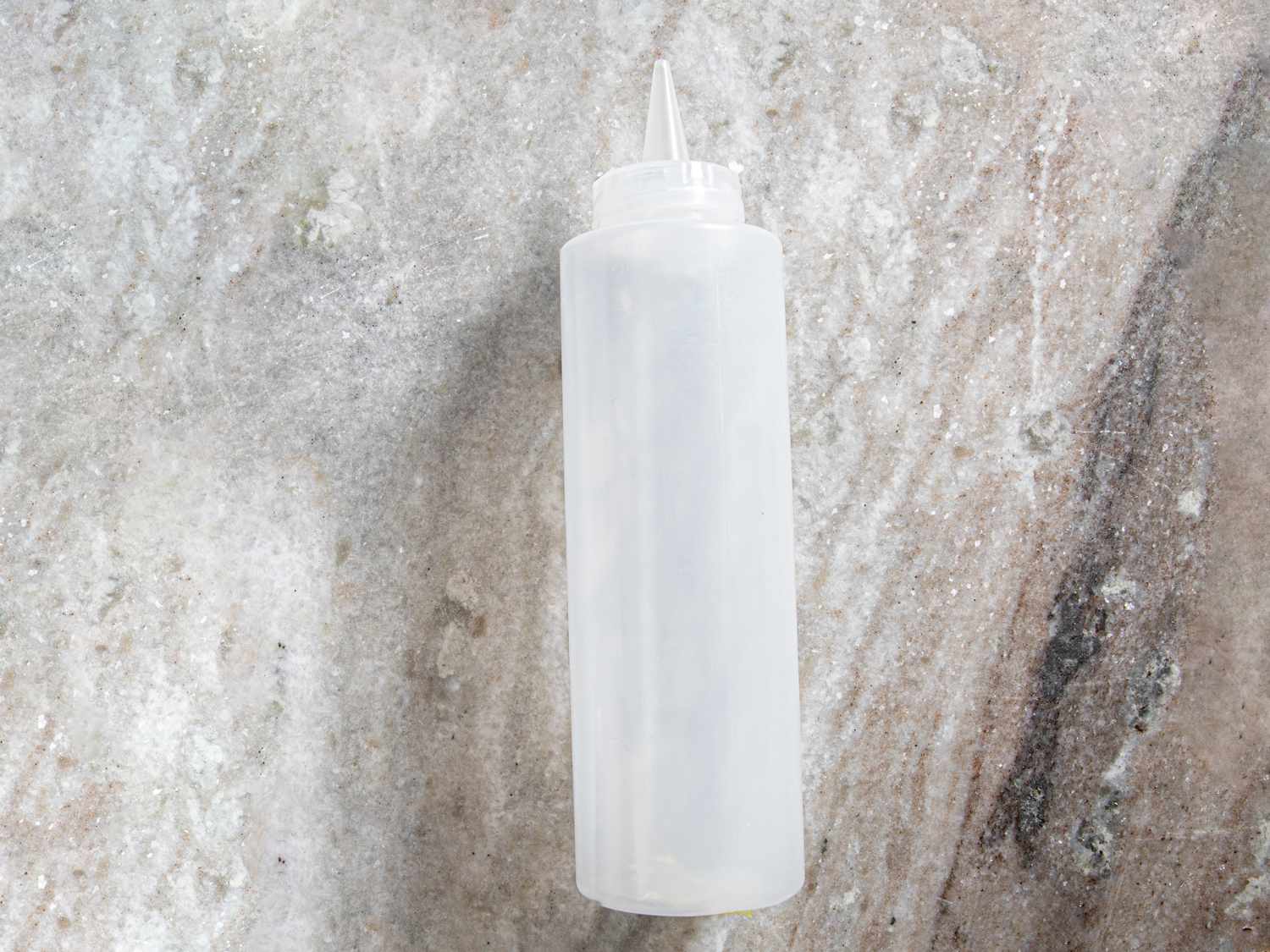 HIC squeeze bottle on a gray marble surface