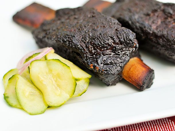 Cooked barbecued short ribs resting on a plate