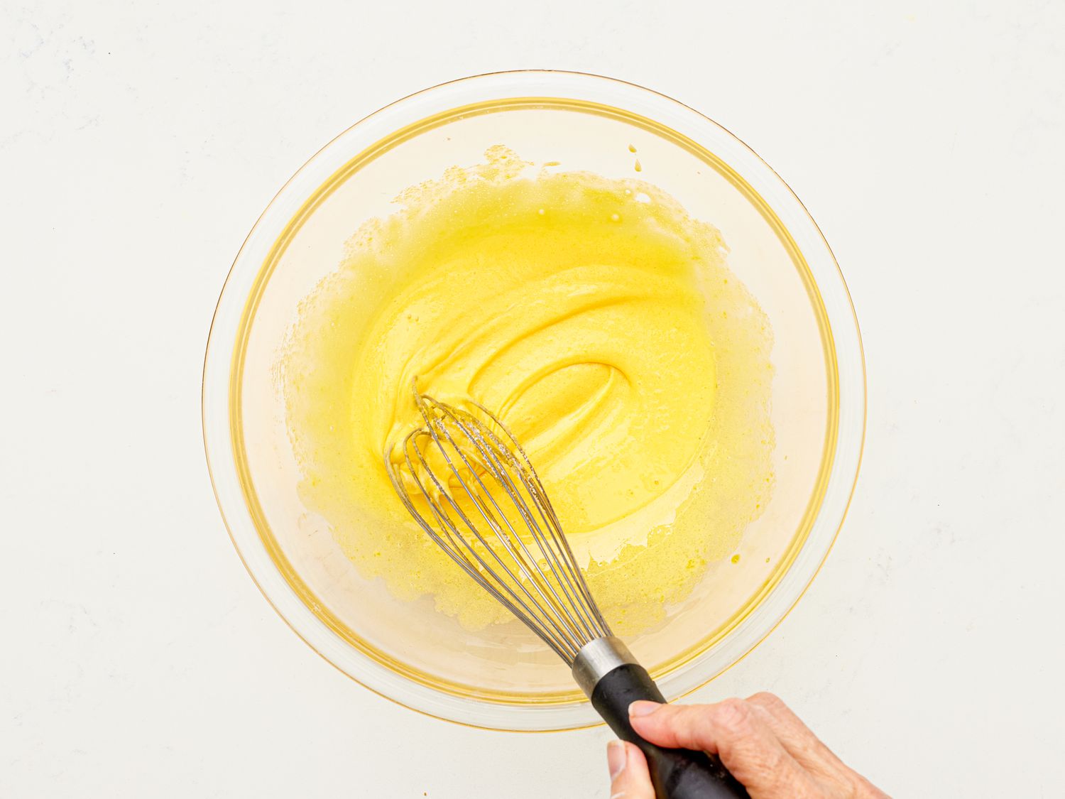 Overhead view of whisking eggs 