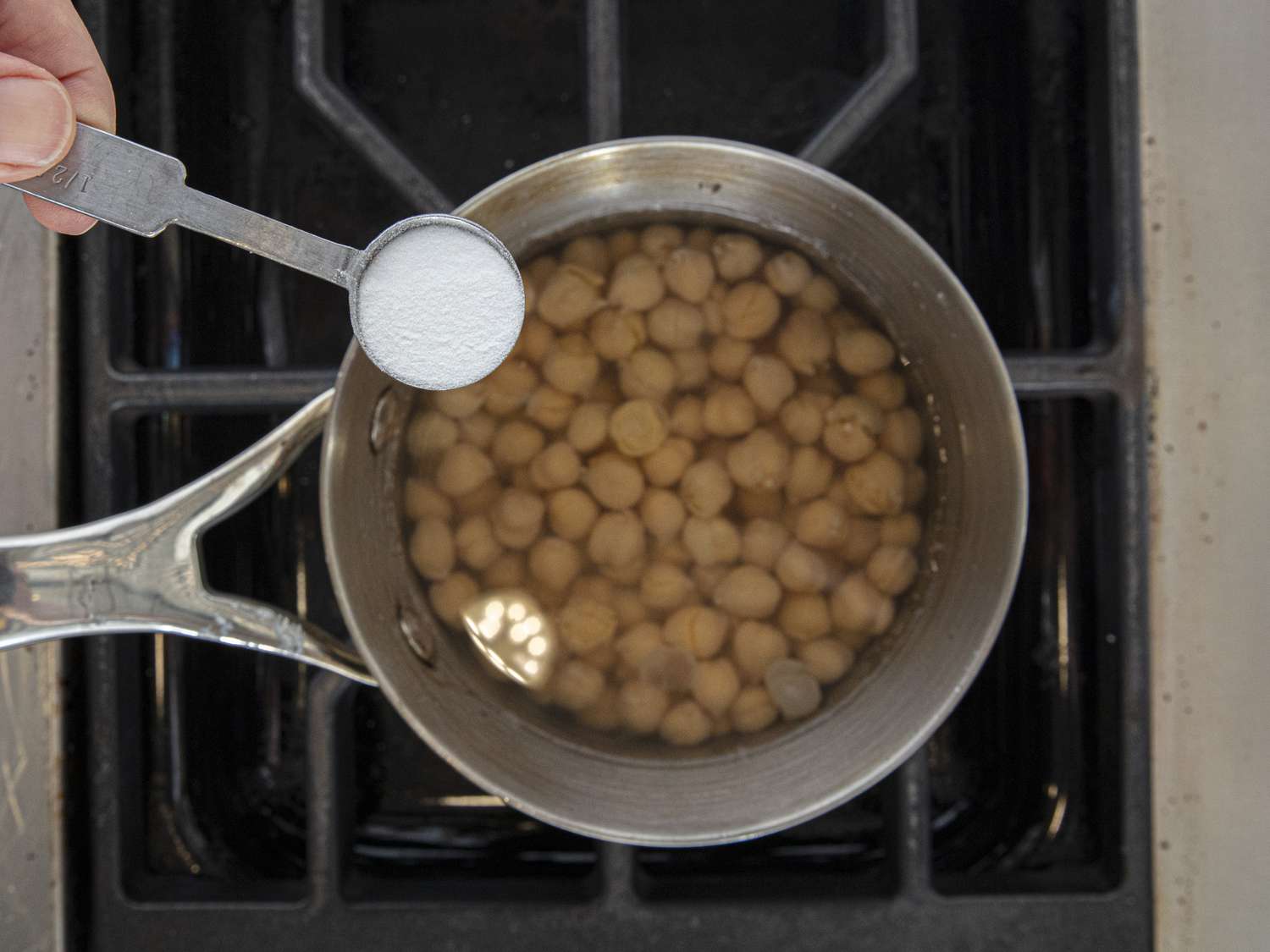 Overhead view of adding to chickpeas