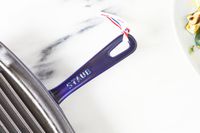 Close-up of the Staub Enameled Cast Iron Grill Pan's handle