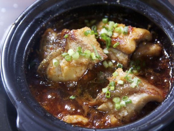 An overhead of a bowl of Ca Kho To (Caramelized Fish in Clay Pot)