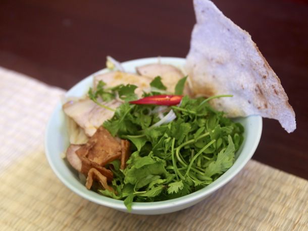Cao lầu resting in a light blue bowl