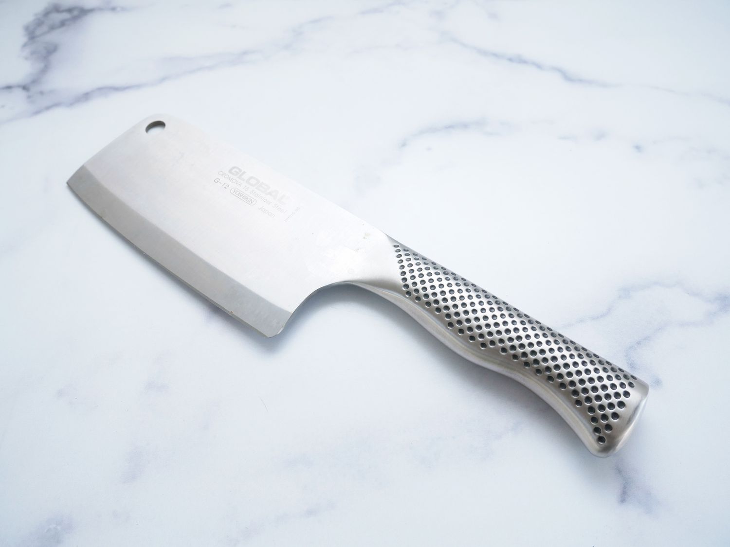the global cleaver on a marble countertop