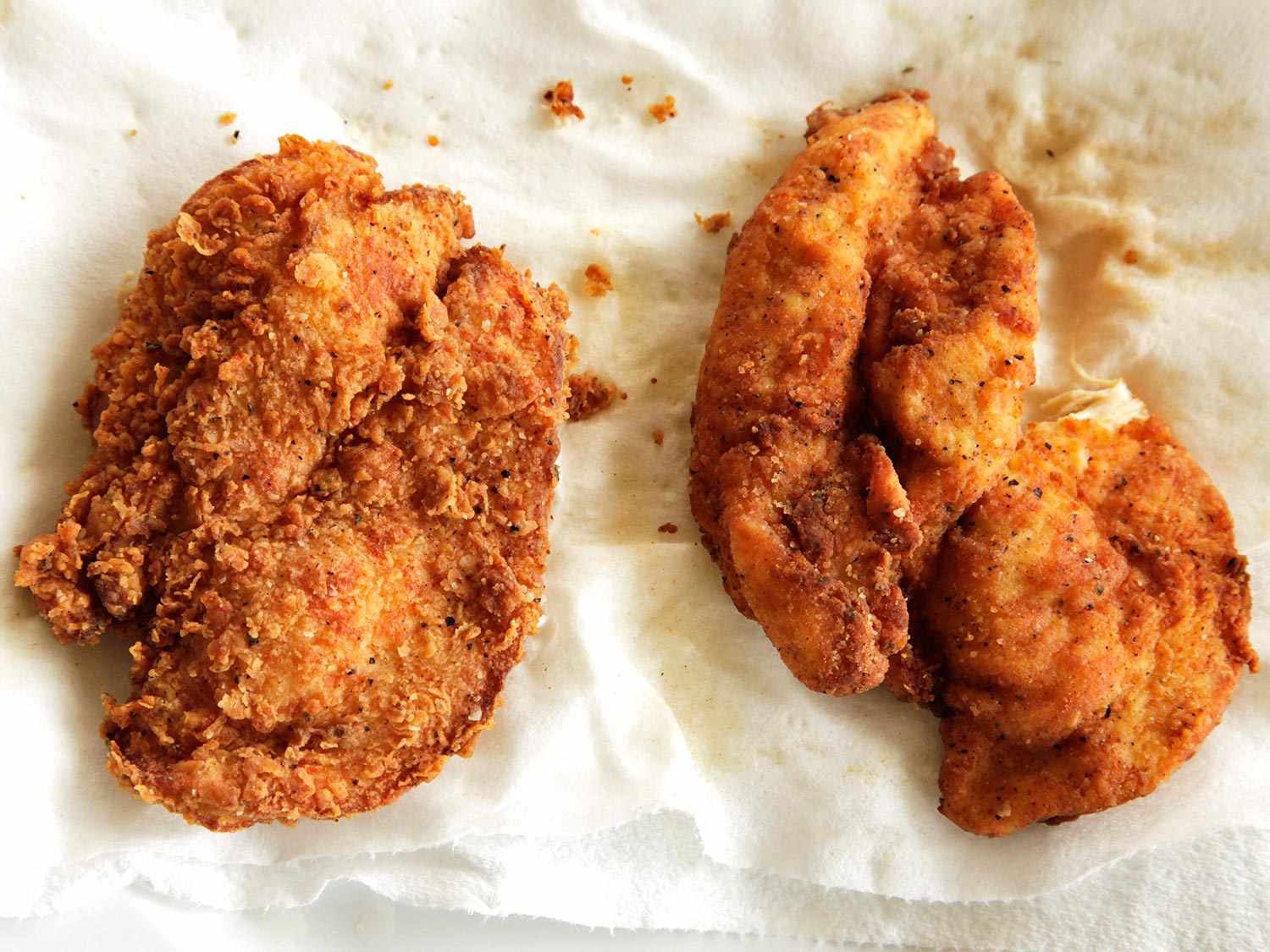 Comparing extra-craggly and normal breading on two pieces of fried chicken
