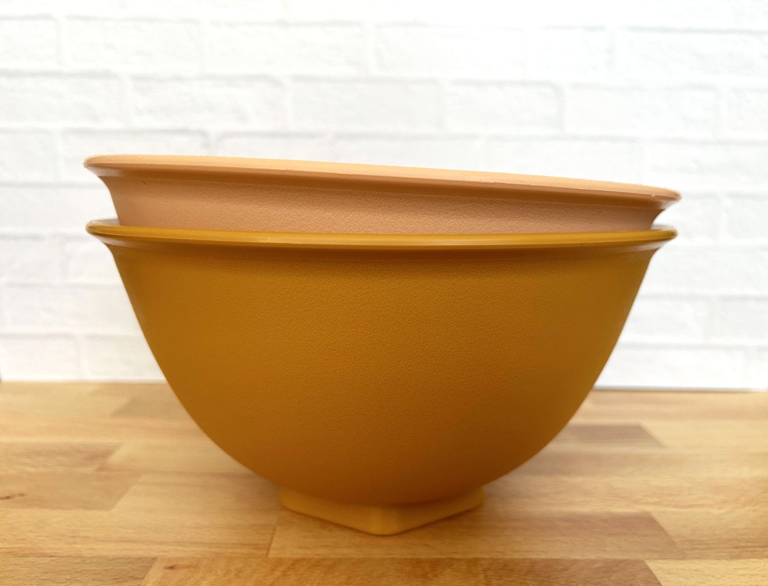 Two stacked mixing bowls on a countertop