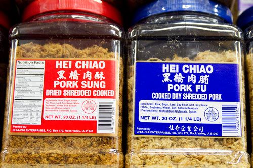 Two containers on a shelf, one with pork sung and one with pork fu.