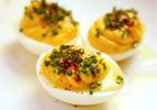 Close up of deviled eggs drizzled with olive oil