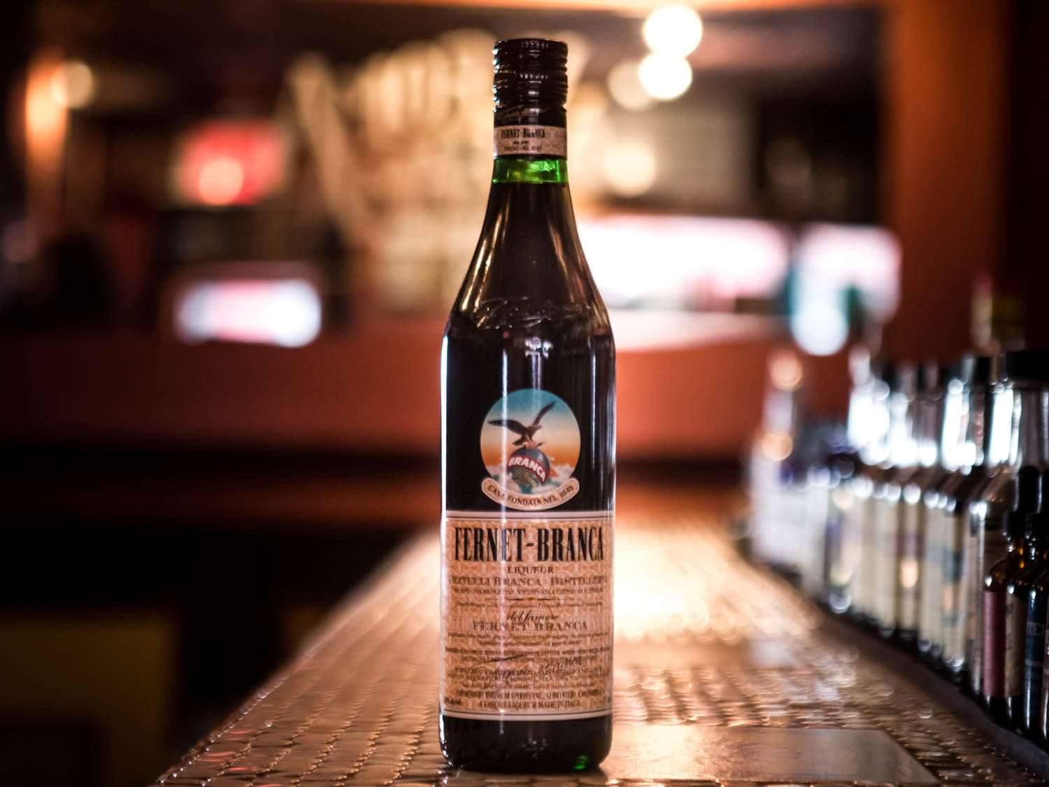 A bottle of Fernet-Branca on a bar counter. 