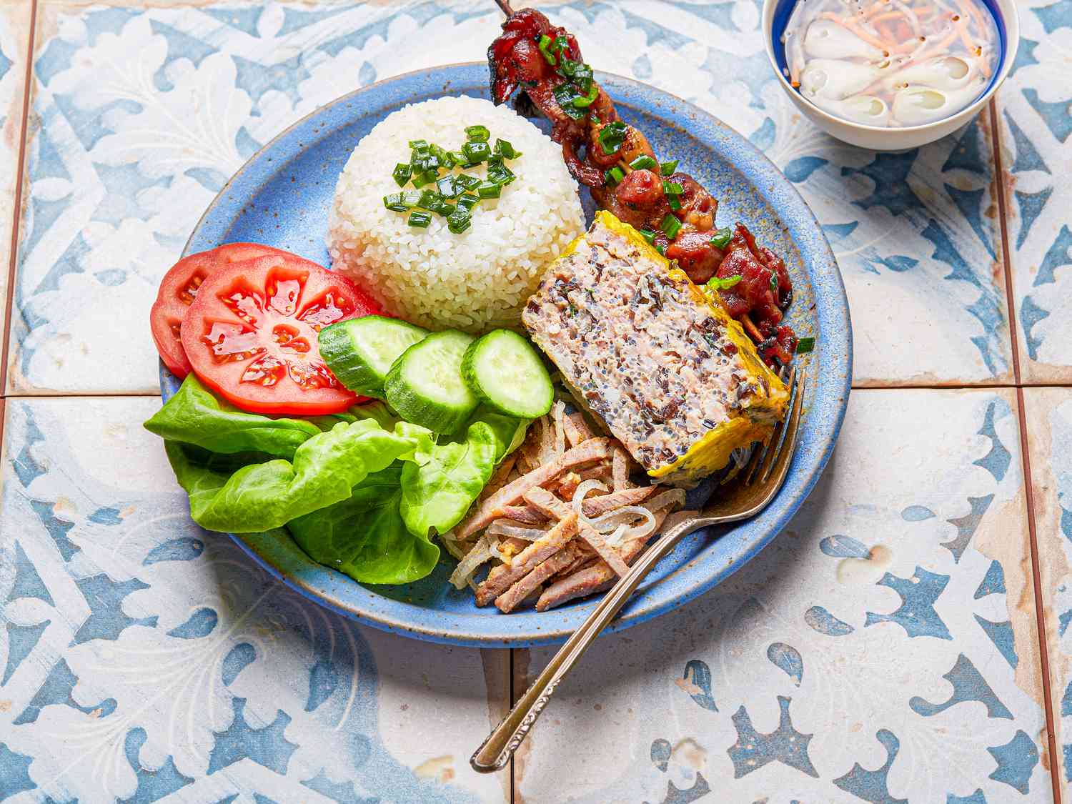 Side angle view of a plate of Broken Rice