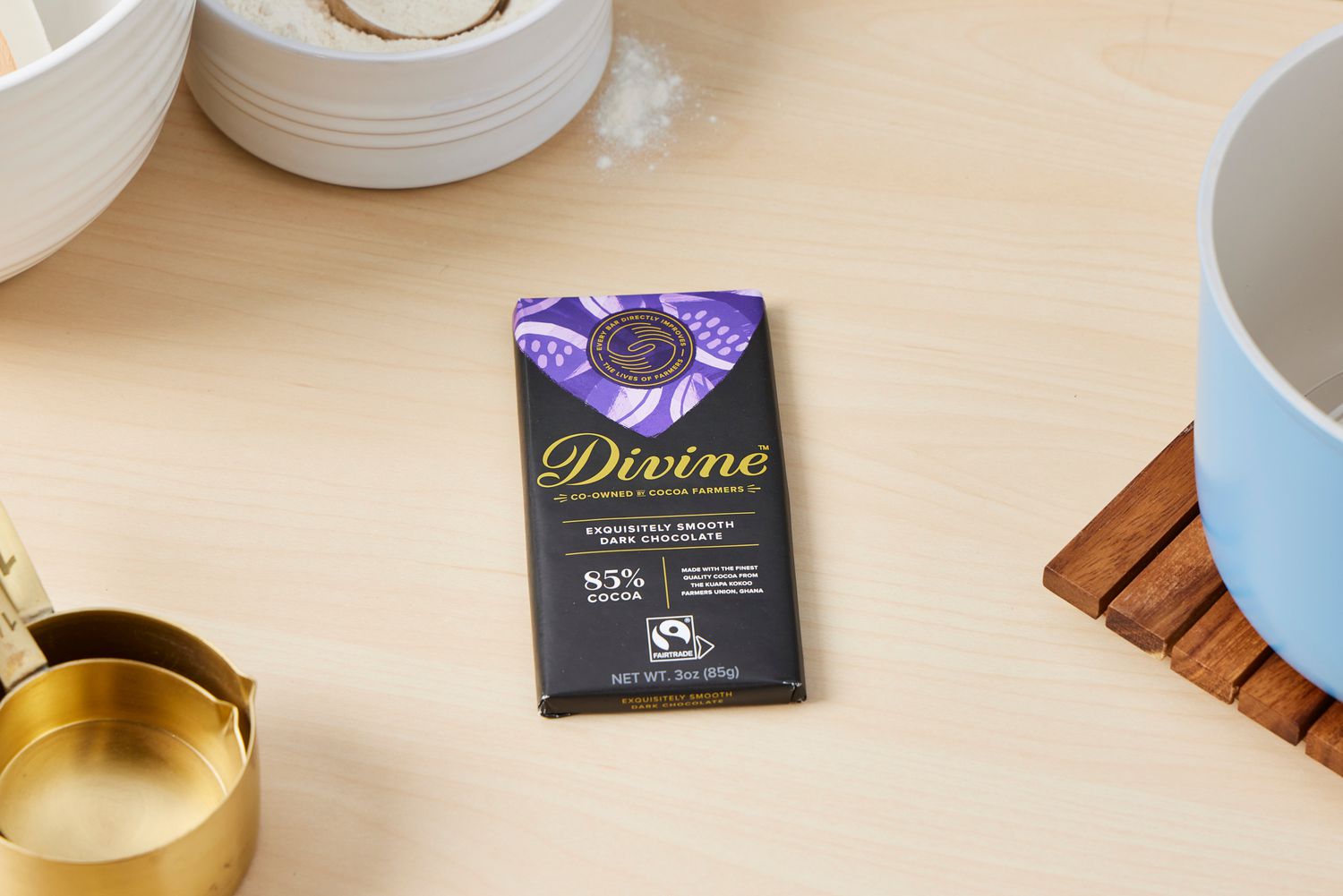 A Divine extra-dark chocolate bar on a kitchen countertop.