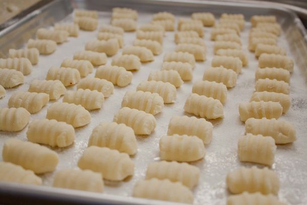 A baking sheet of ridged, gluten-free gnocchi.