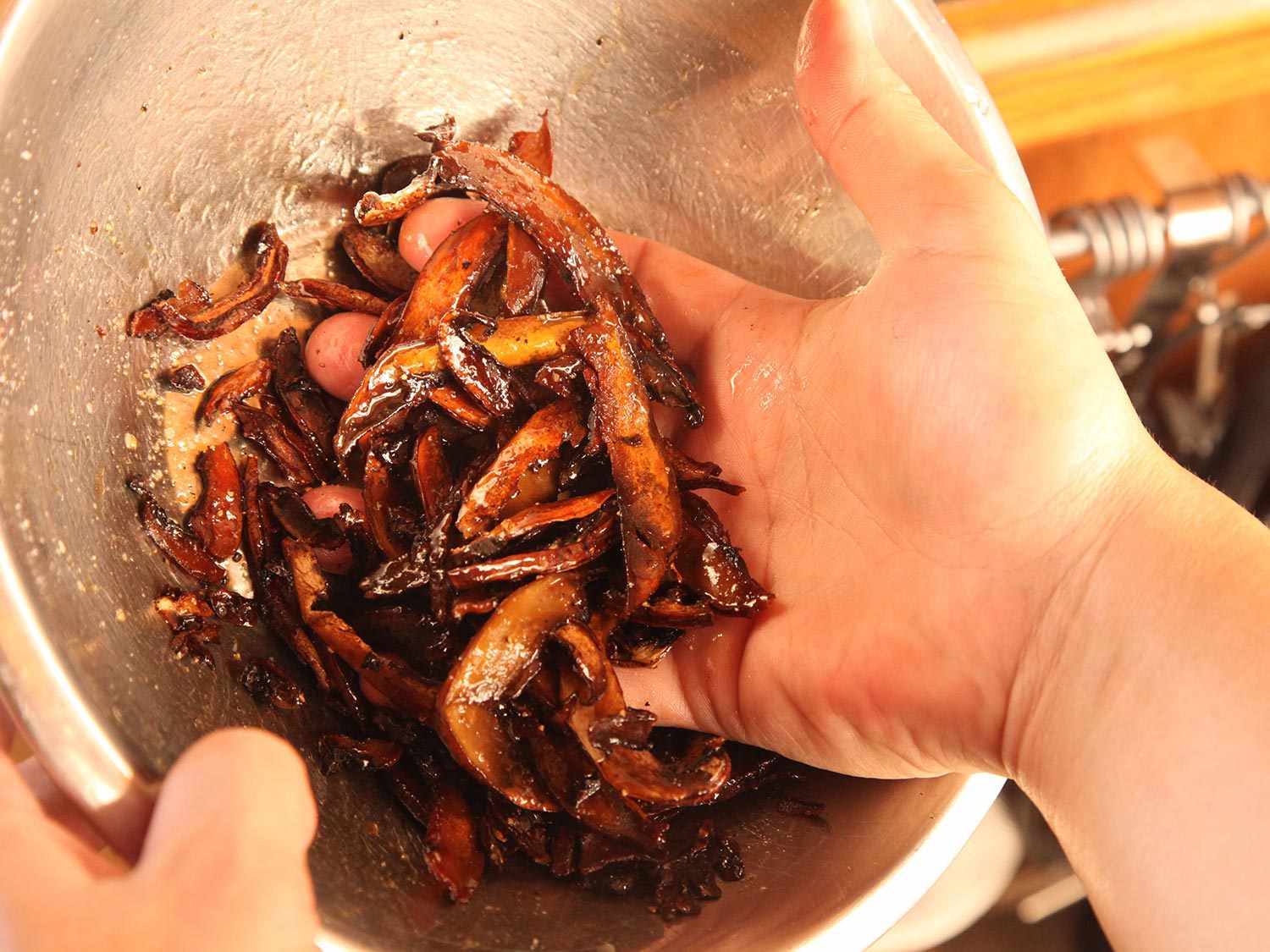 Tossing mushroom bacon in spice mix.