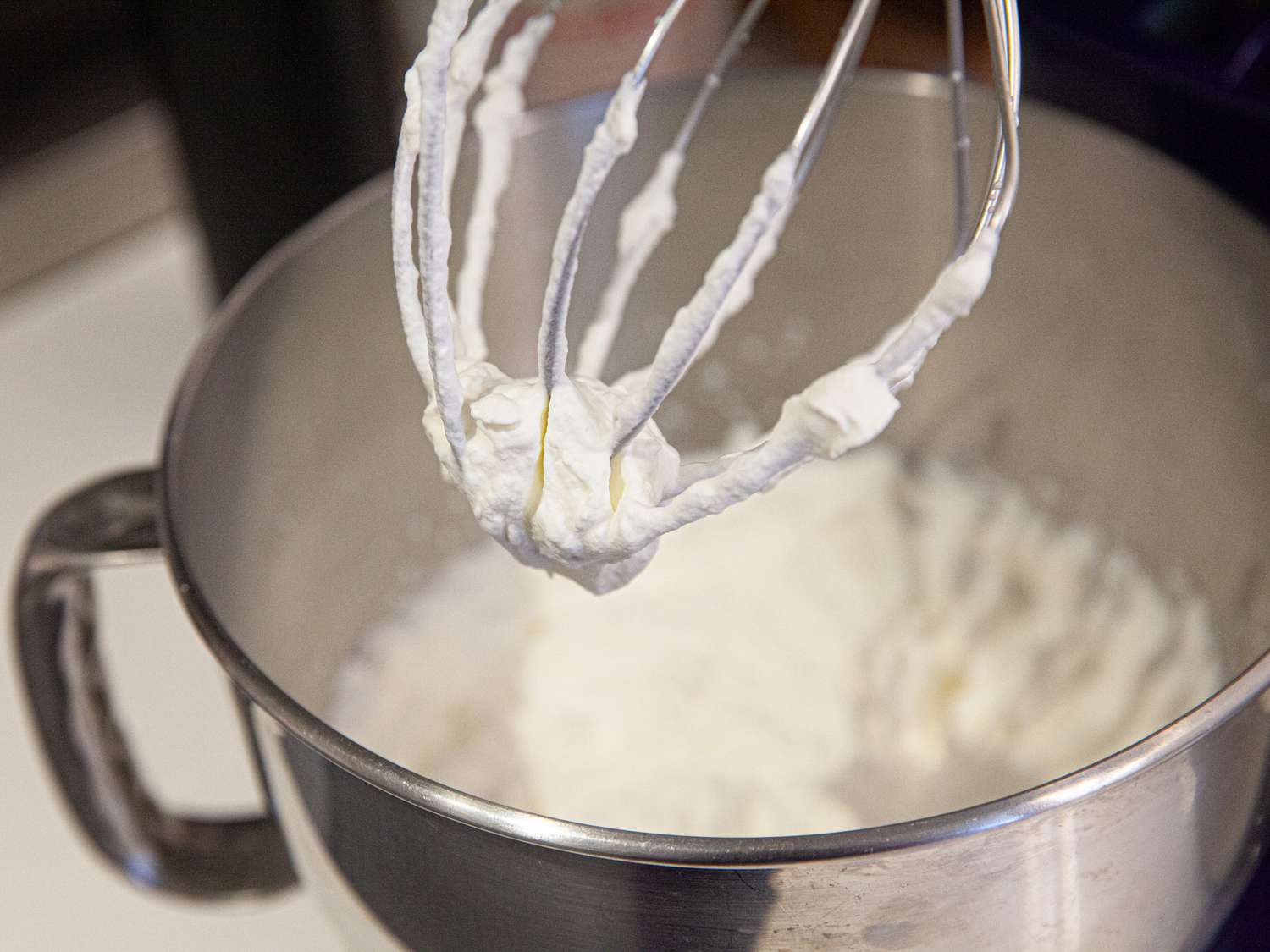 Whipped cream in a mixing bowl.