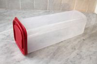 The Budeez bread box on a marble countertop.