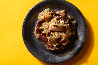 Overhead of a small plate of marinated eggplant banchan