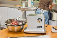 Weston #12 Electric Meat Grinder & Sausage Stuffer displayed on counter top