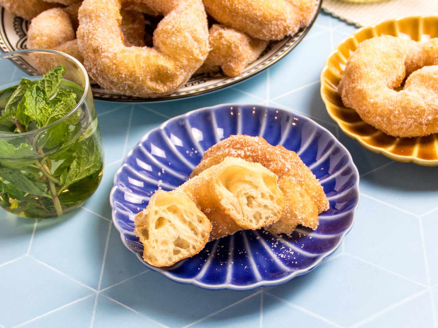 Moroccan donuts with a glass of mint tea on a table