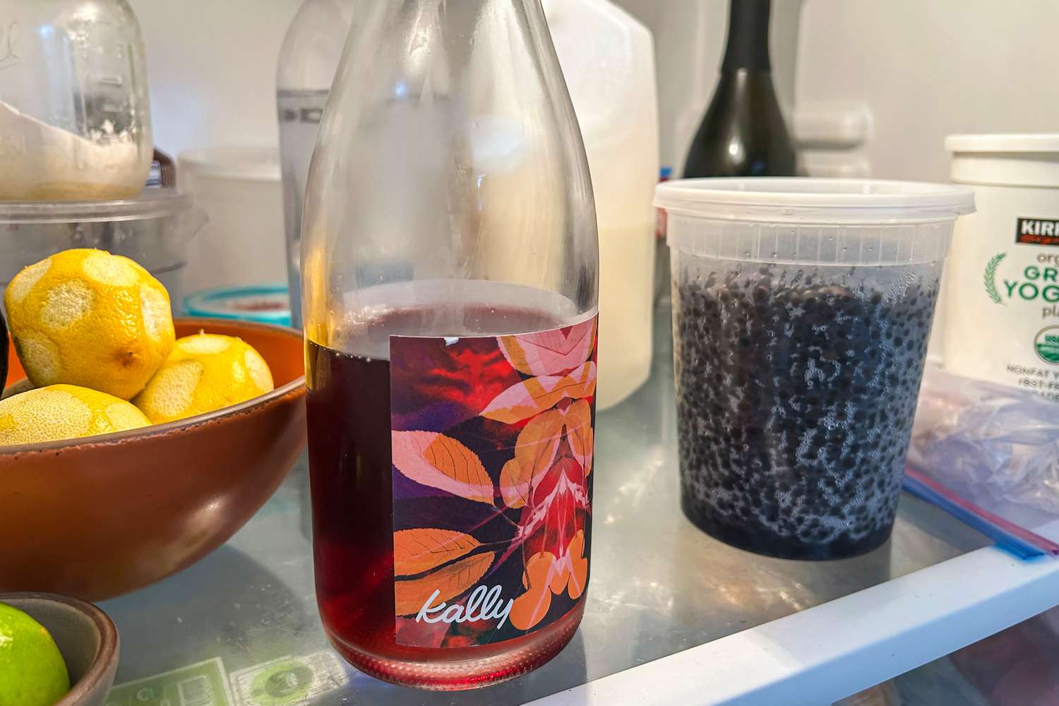 A bottle of red wine in a refrigerator