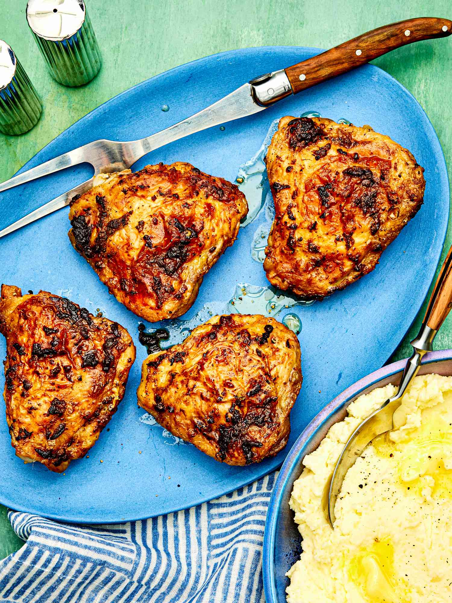 A blue platter with air-fryer chicken thighs