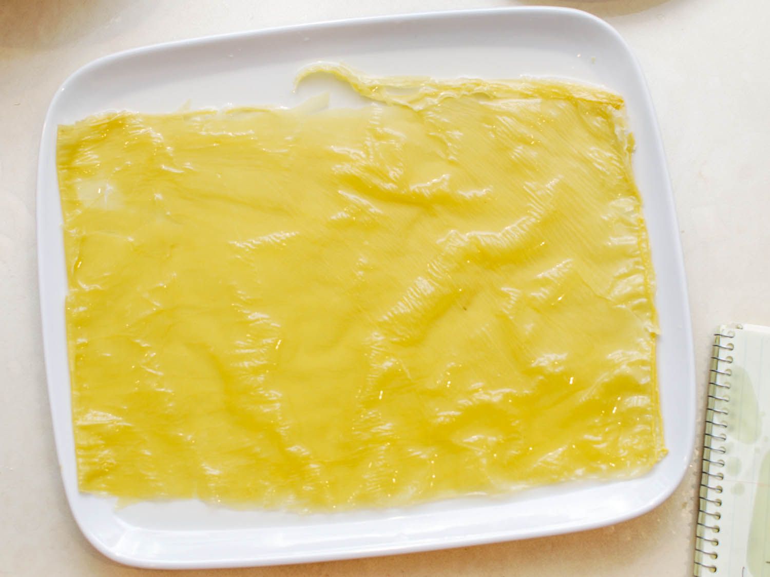 Soaked bean curd skin sheets, ready to roll.