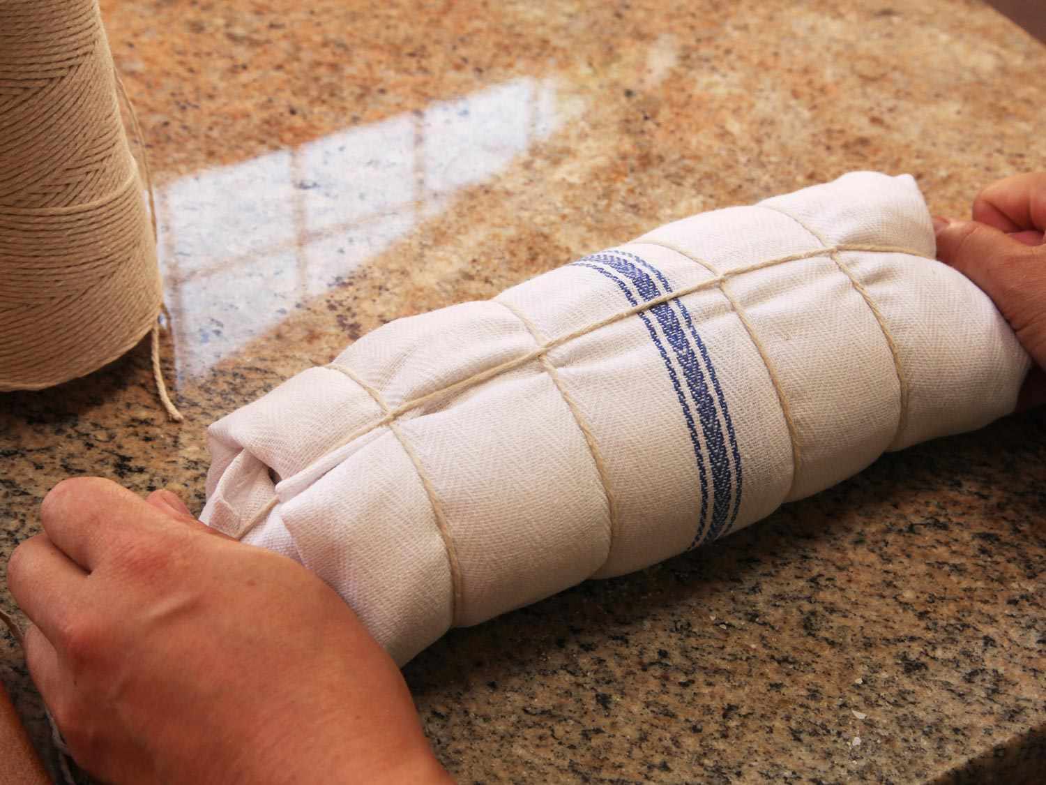 The wrapped roast is tied with butcher's twine.