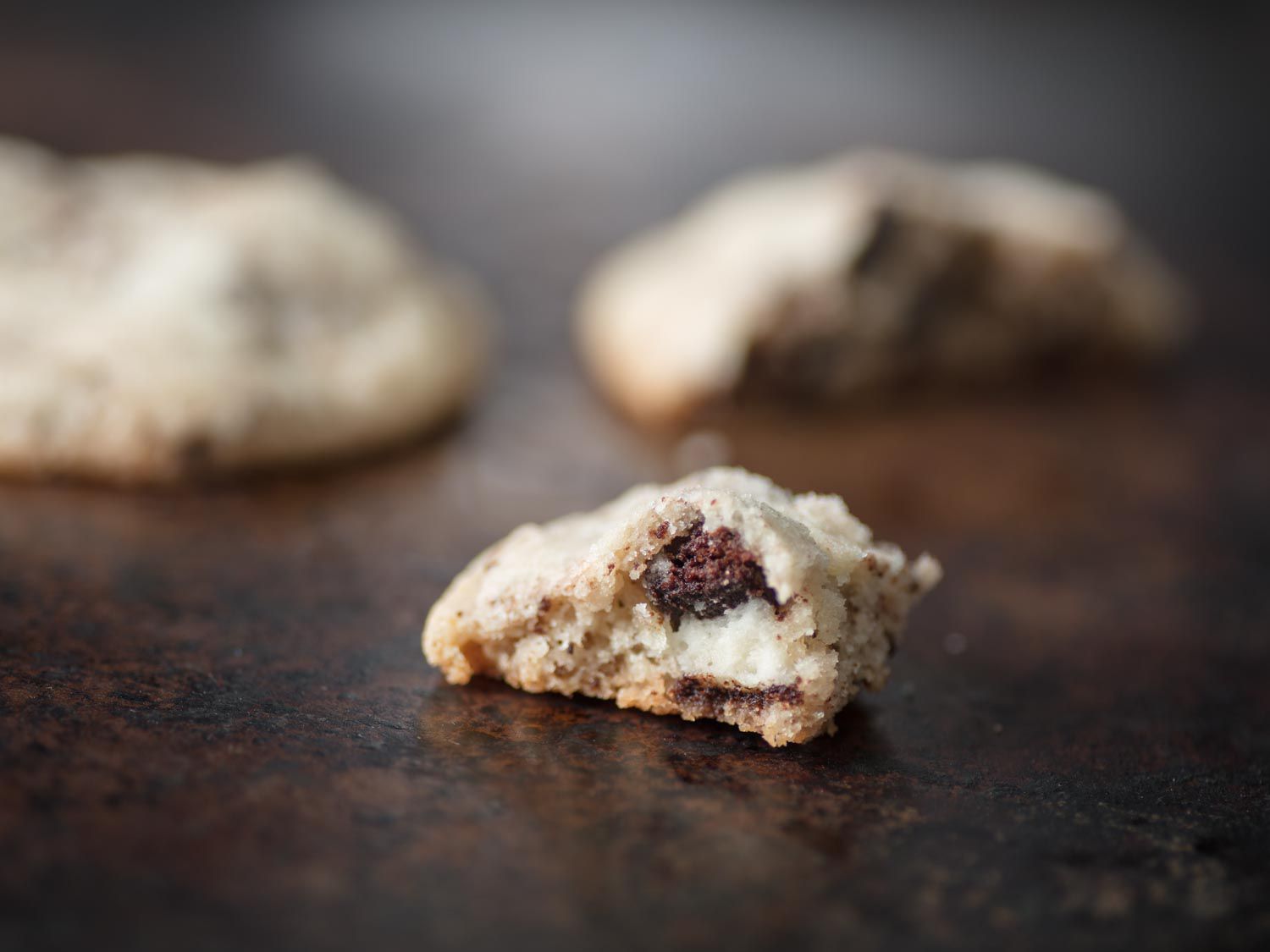 Cross-section view of cookies and cream cookie showing the intact Oreo creme.