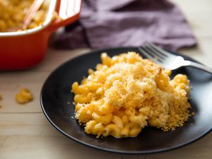 A plate of modern baked mac and cheese with cheddar and gruyère, sprinkled with bread crumbs