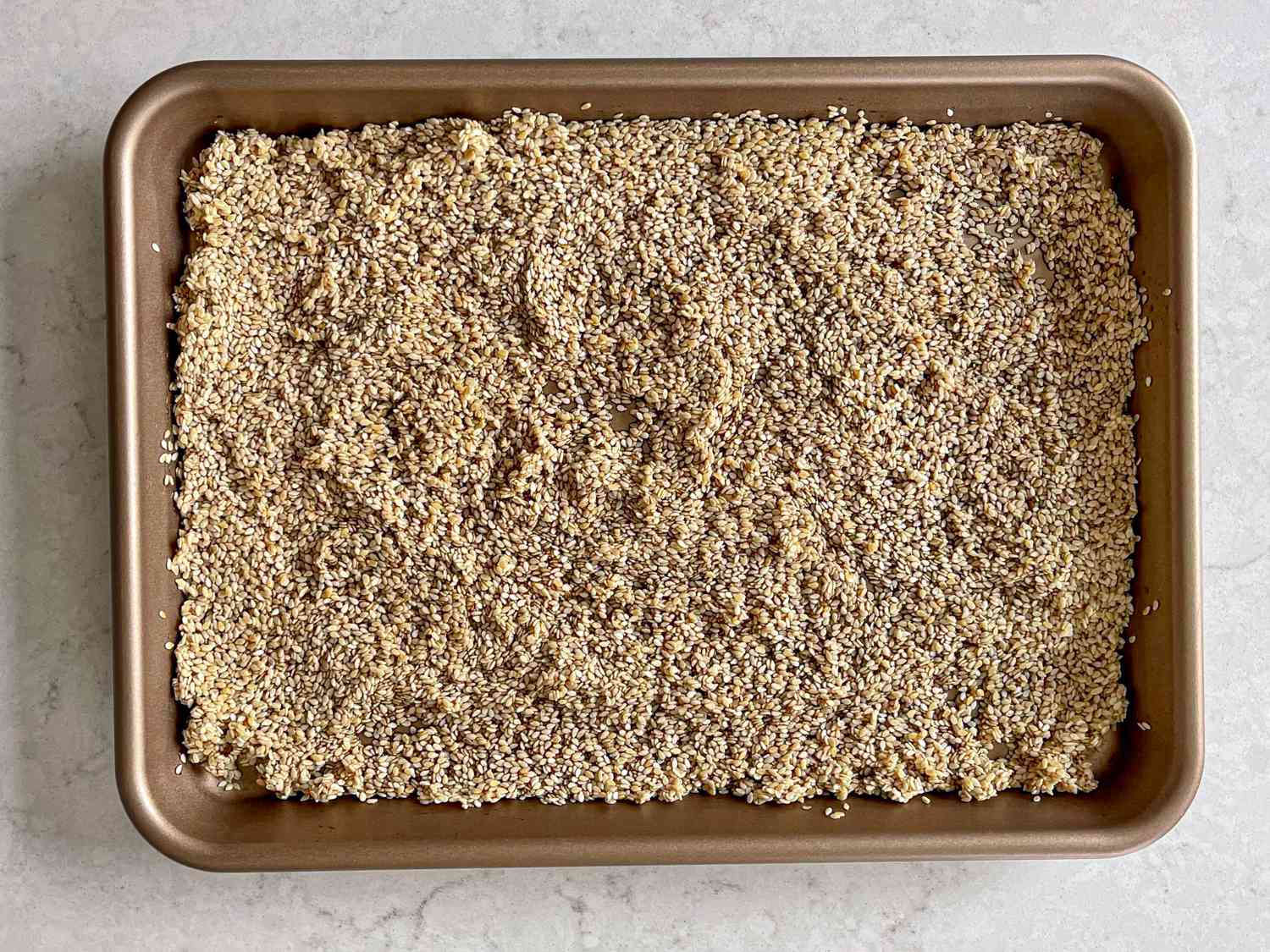 Overhead view of sesame seeds in molasses 