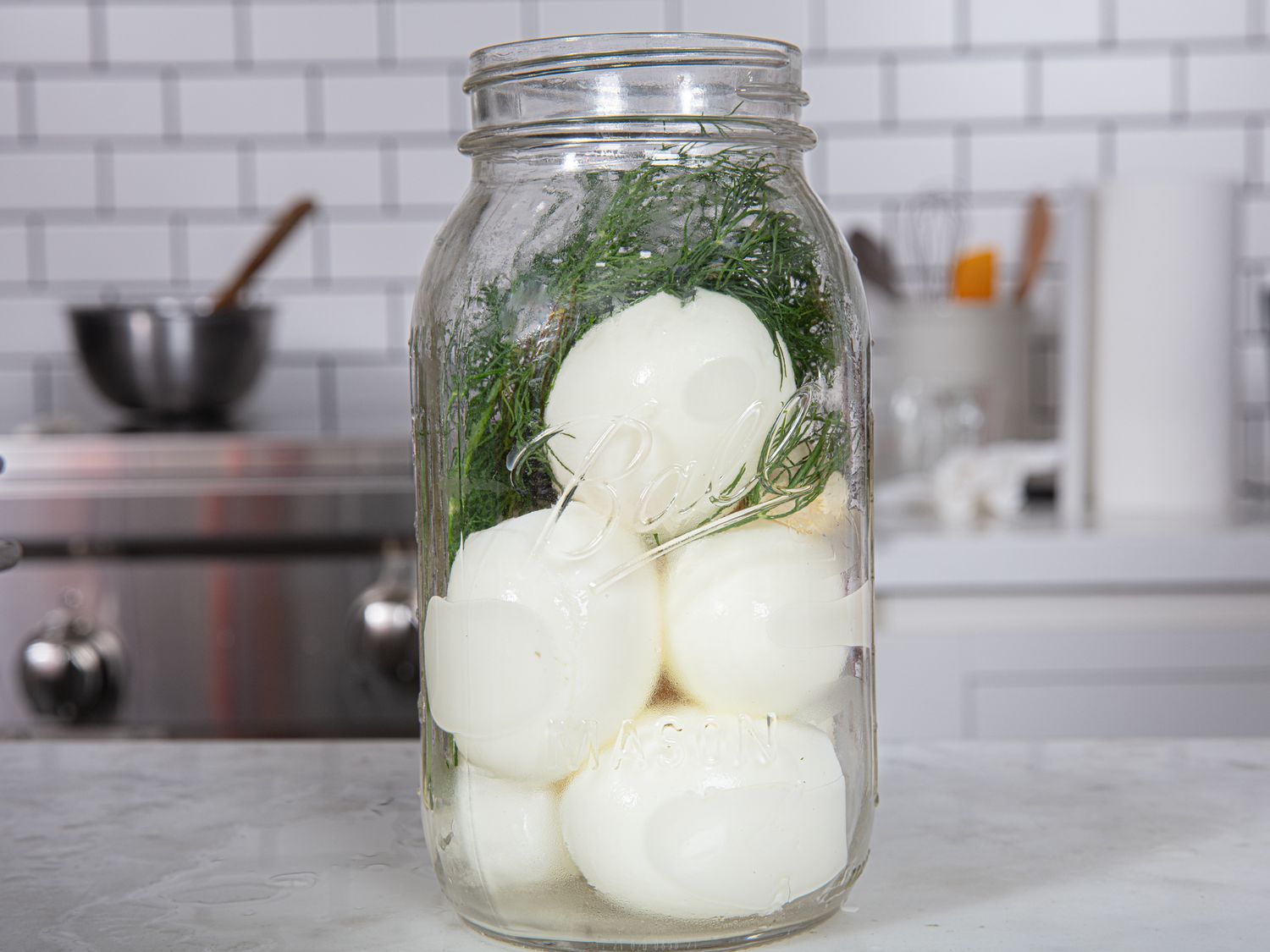 Side view of eggs in jar