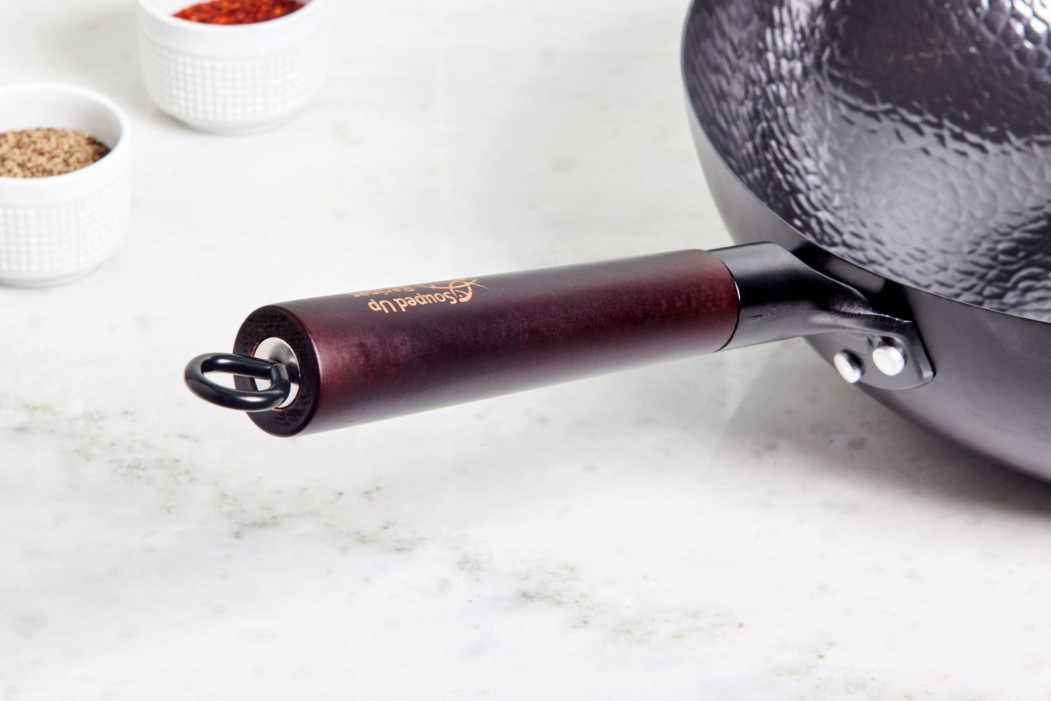 Close up of handle of the Souped Up Recipes Carbon Steel Wok