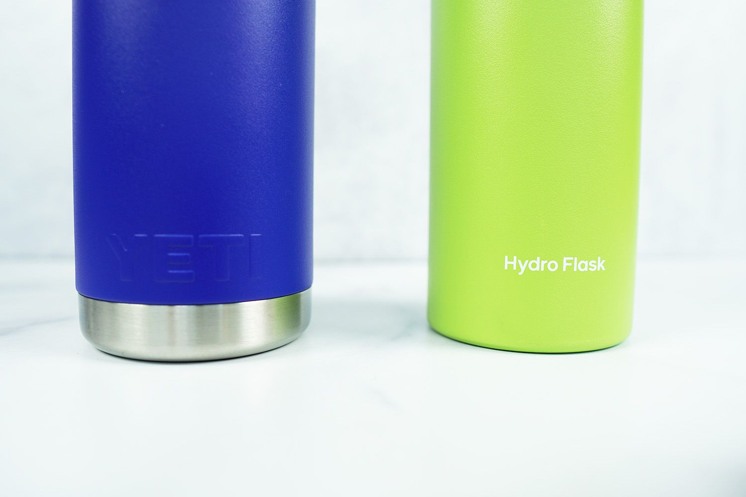 Alook at the bases of of the hydro flask and yeti water bottles in two different colors