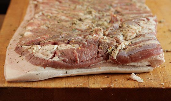 Well-seasoned pork belly slab for porchetta