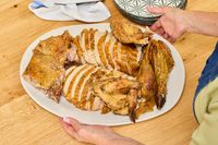 A carved KellyBronze Turkey laid out on a serving platter