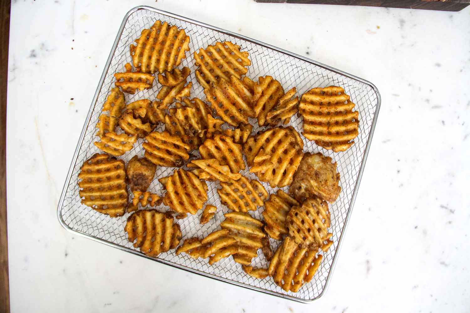Waffle fries on a cooling rack