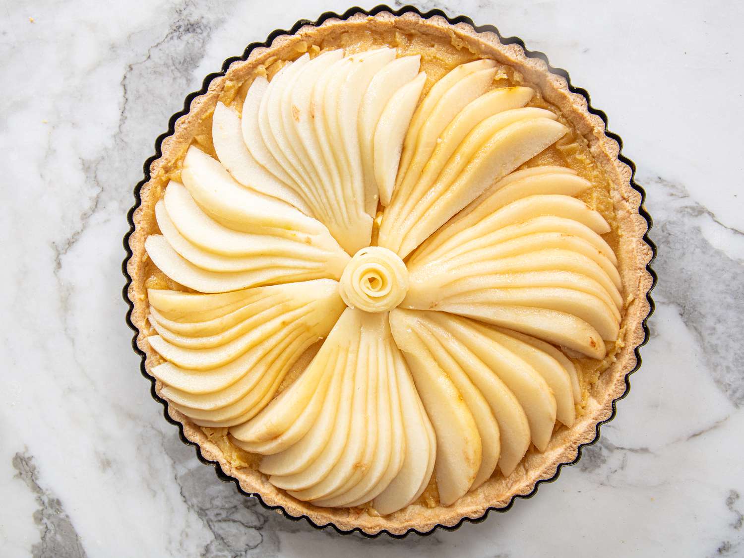Overhead view of pears on tart
