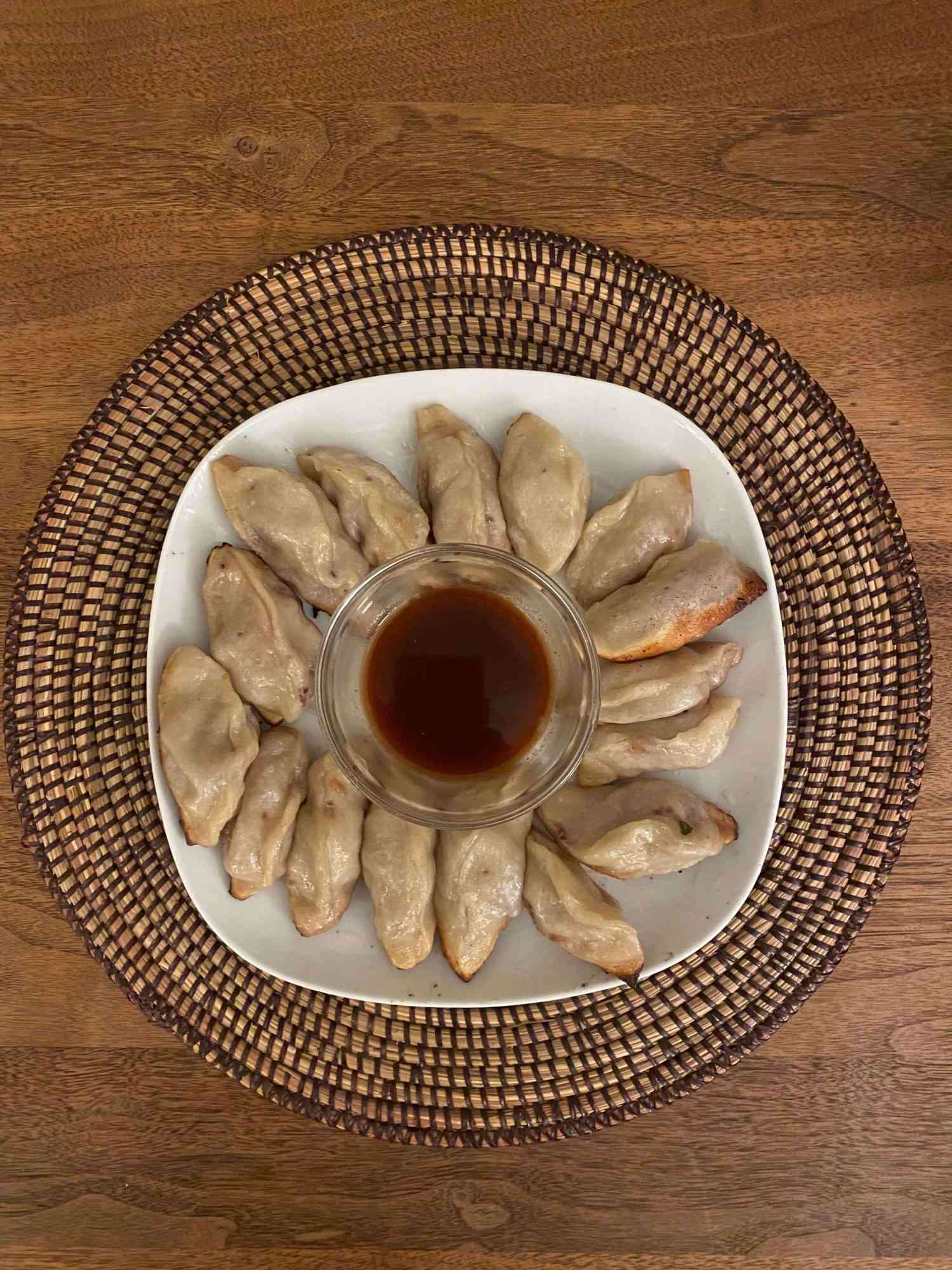 plate of pork and scallion dumplings