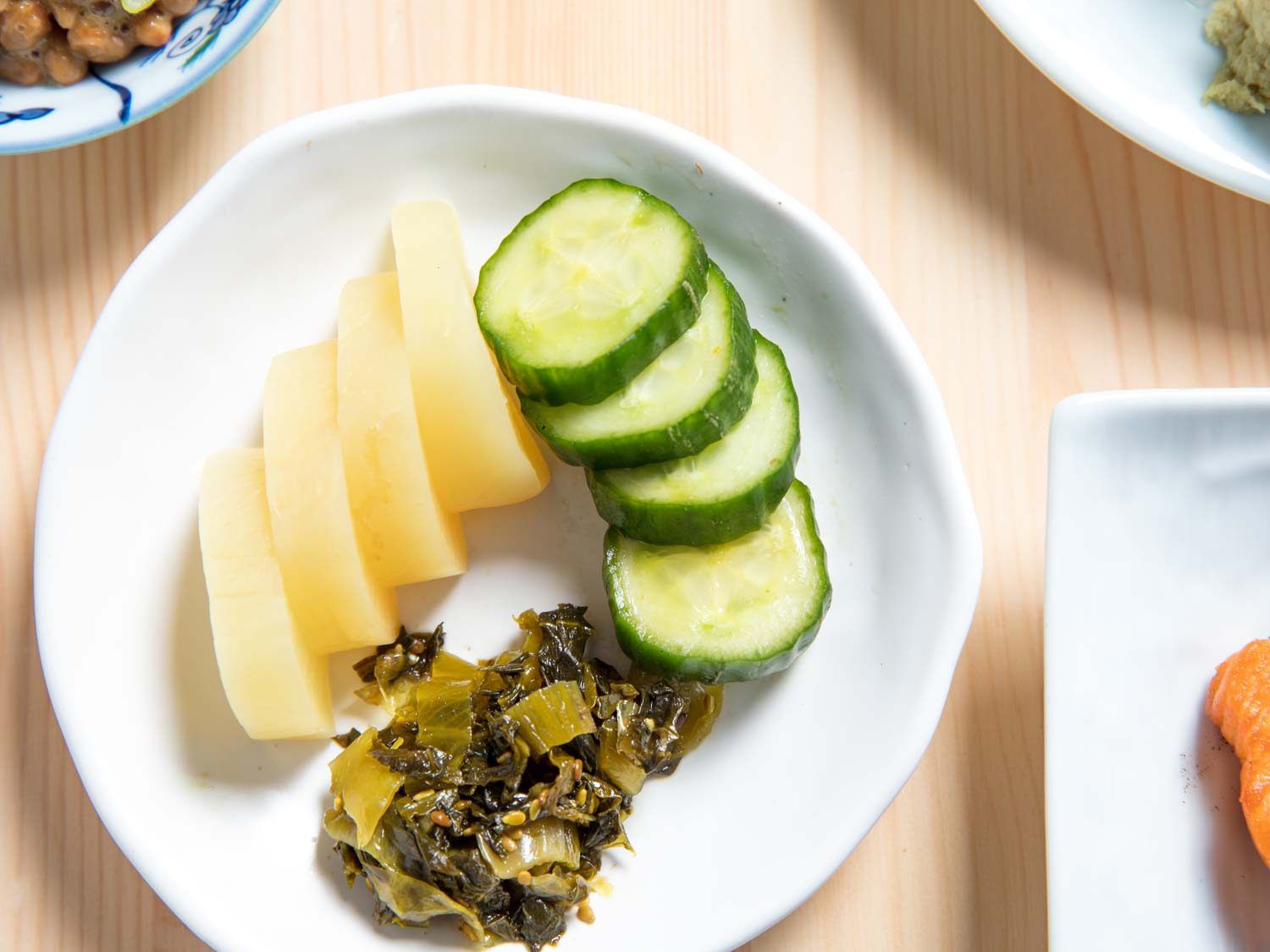 Pickled daikon, quick-pickled cucumbers, pickled mustard leaf