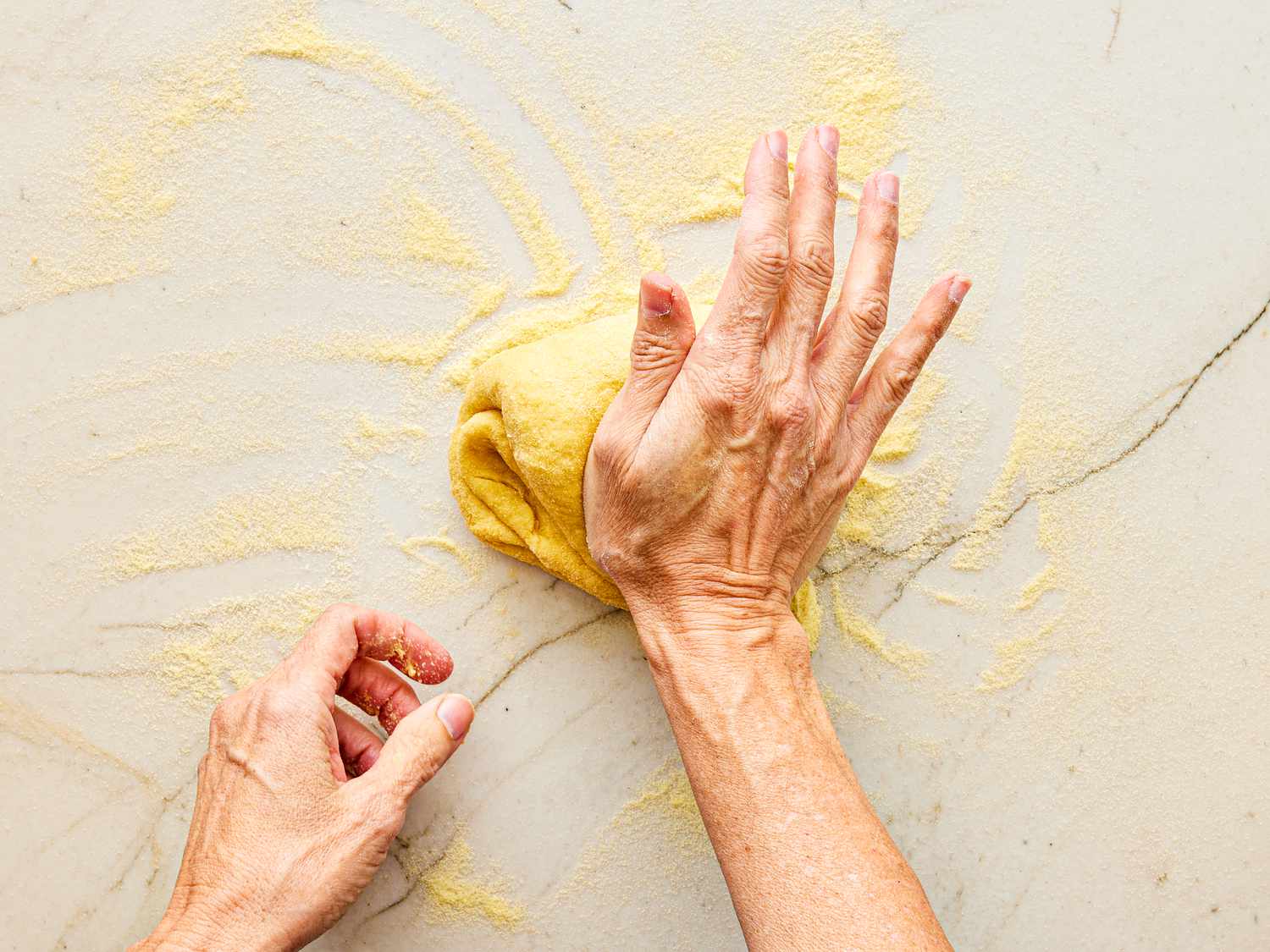 Overhead view of rolling dough out