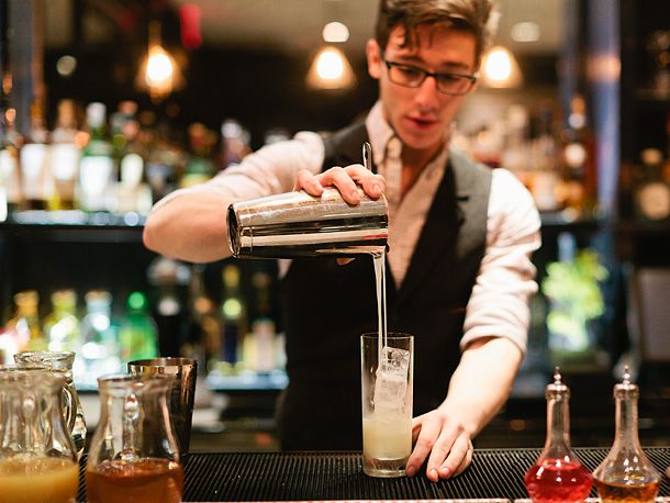Bartender pouring a cocktail