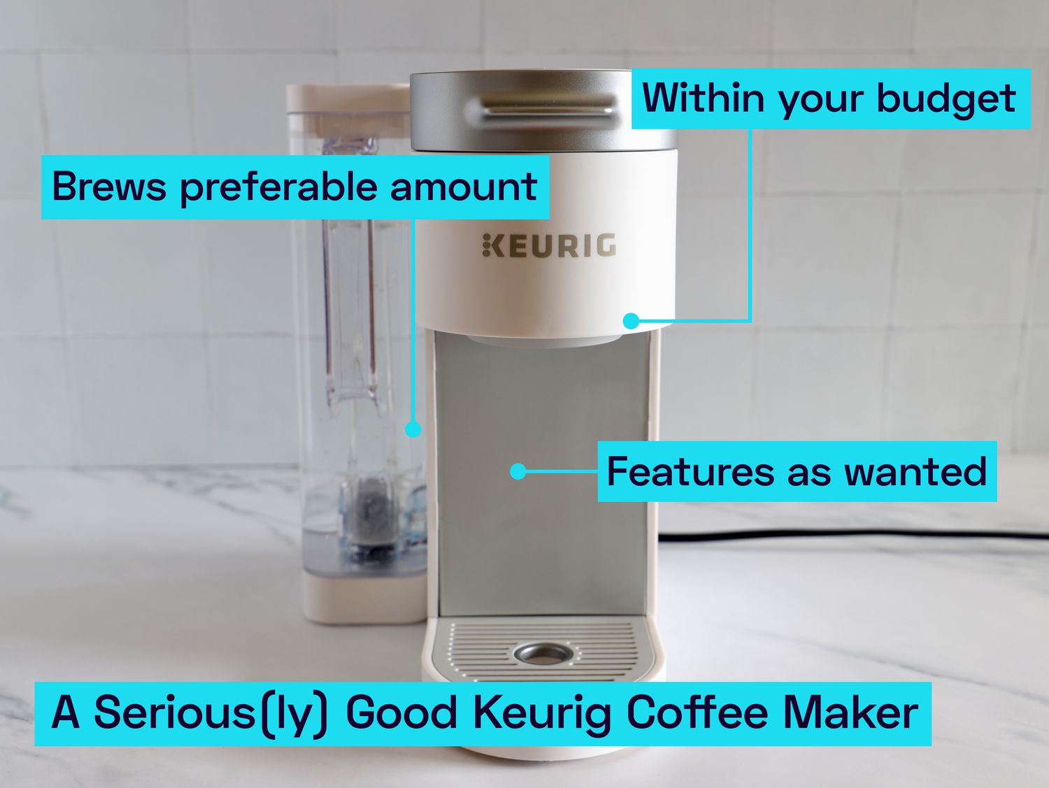 A Keurig coffee maker on a marble kitchen countertop.