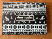 A box with the slogan "Snacks Guys Love"