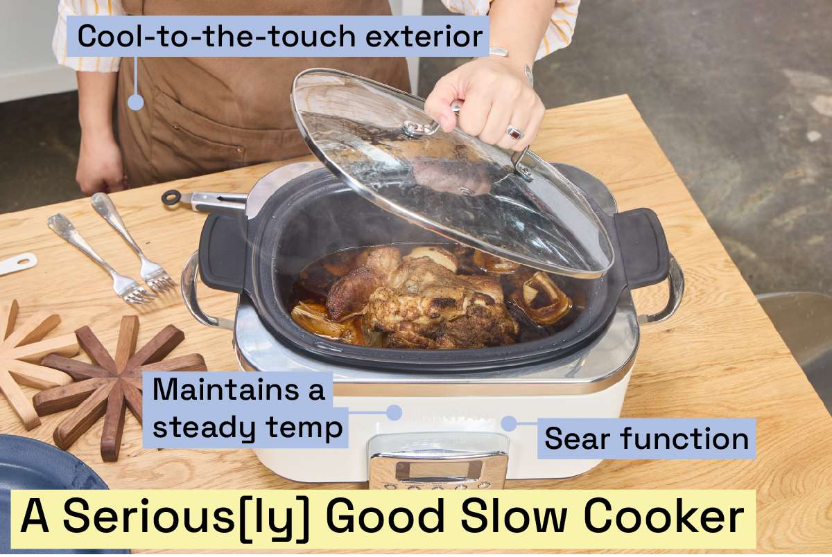 A person lifting the lid of the Greenpan slow cooker